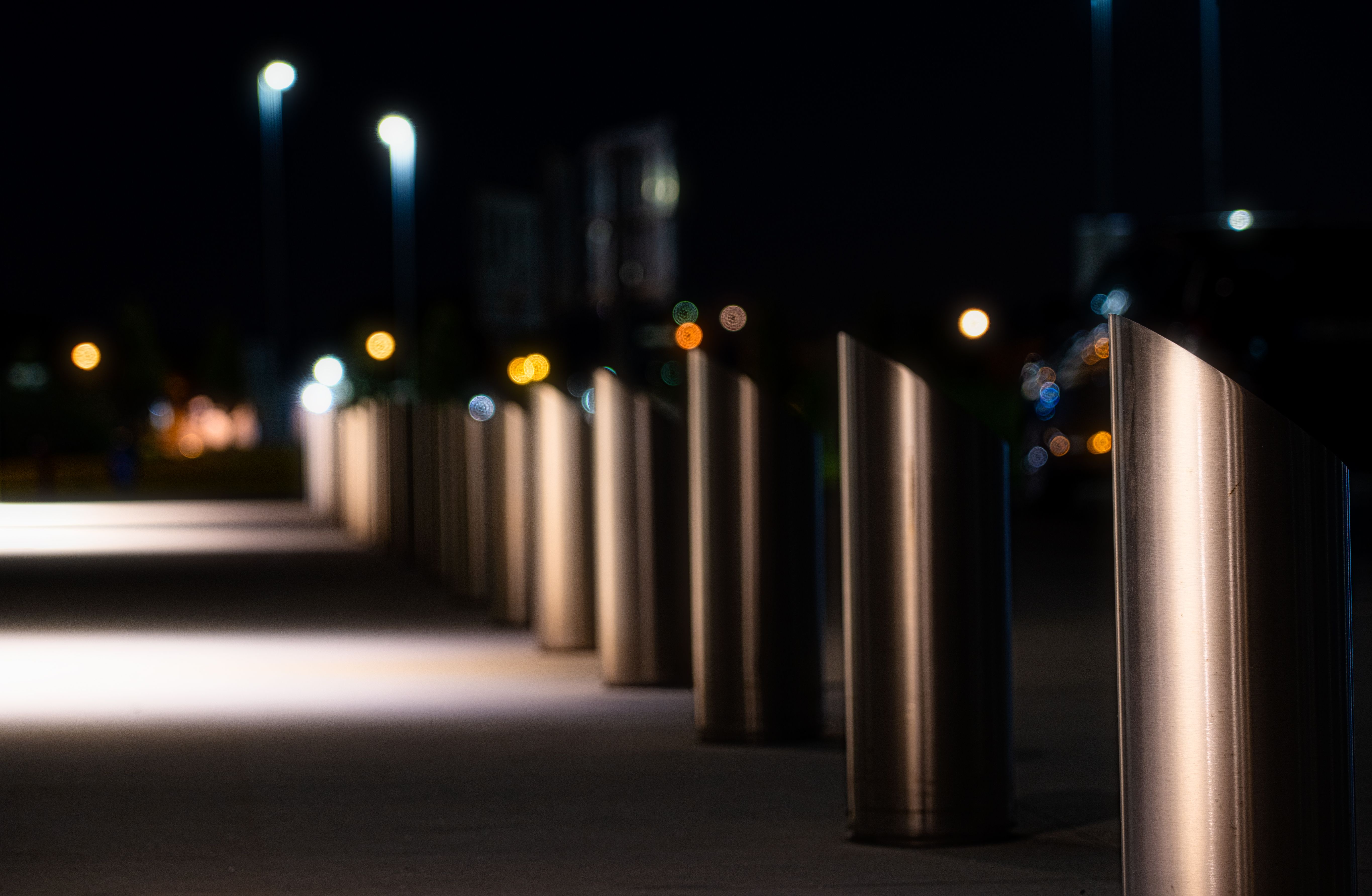 Illuminated perimeter bollards at a modern property