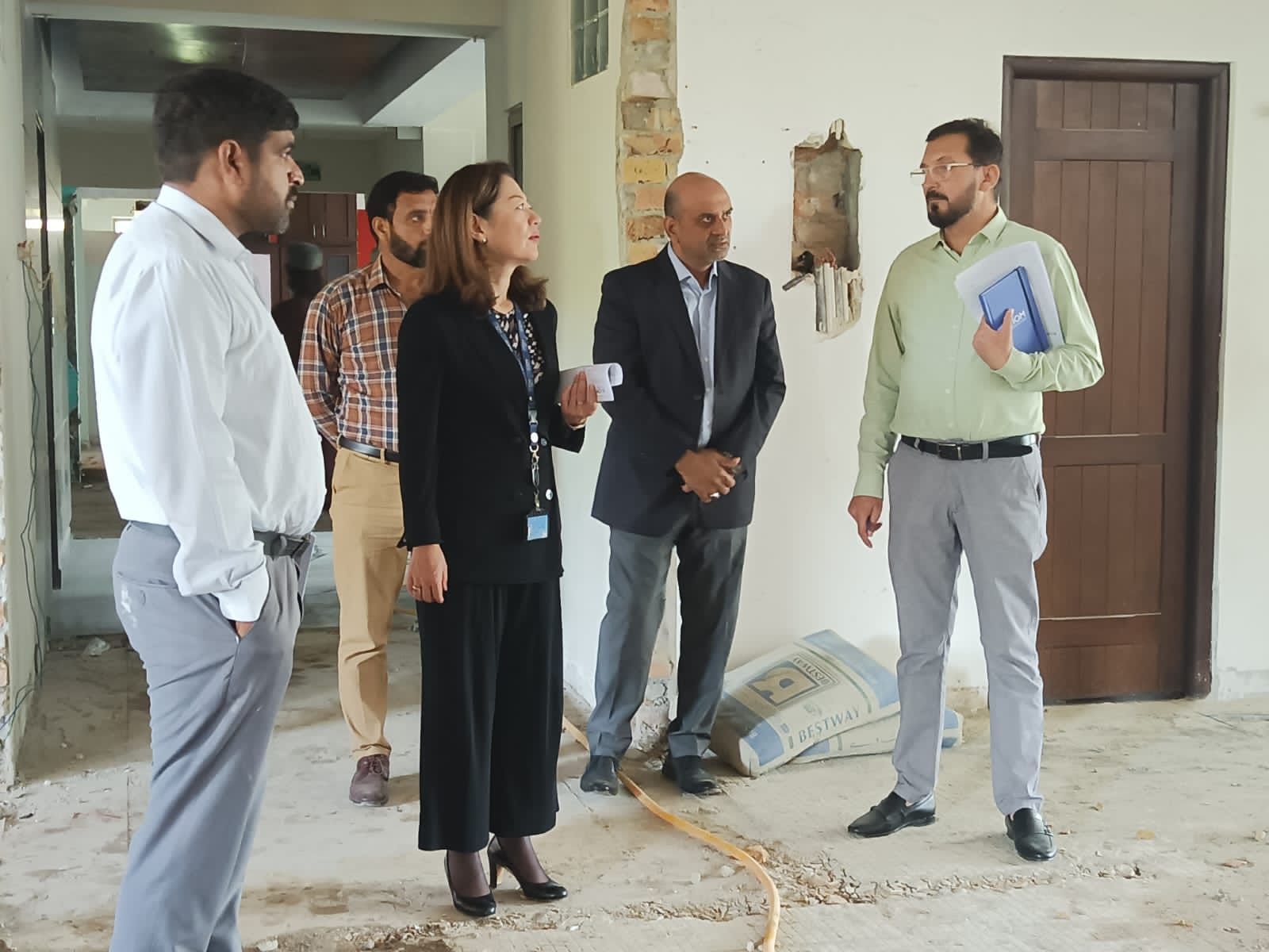 Ali Brothers and IOM representatives coordinating refurbishment work on site